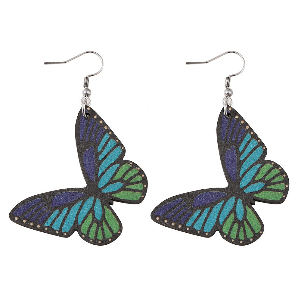 Alas de mariposa al por mayor Pendientes de madera de doble cara